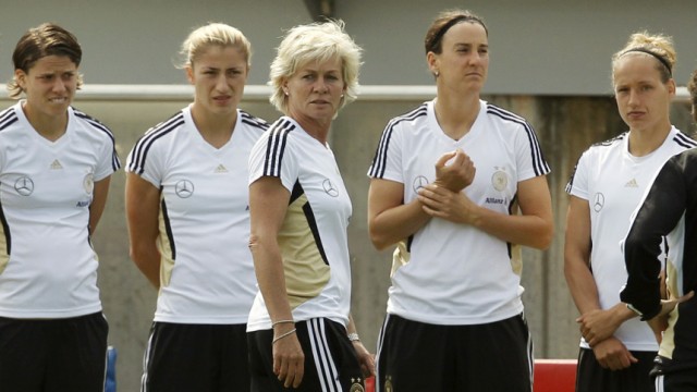 German national soccer coach Silvia Neid  talks to her players during a training session ahead of the Women's World Cup in Berlin