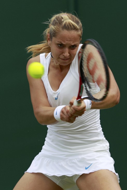 Sabine Lisicki of Germany hits a return to Misaki Doi of Japan at the Wimbledon tennis championships in London