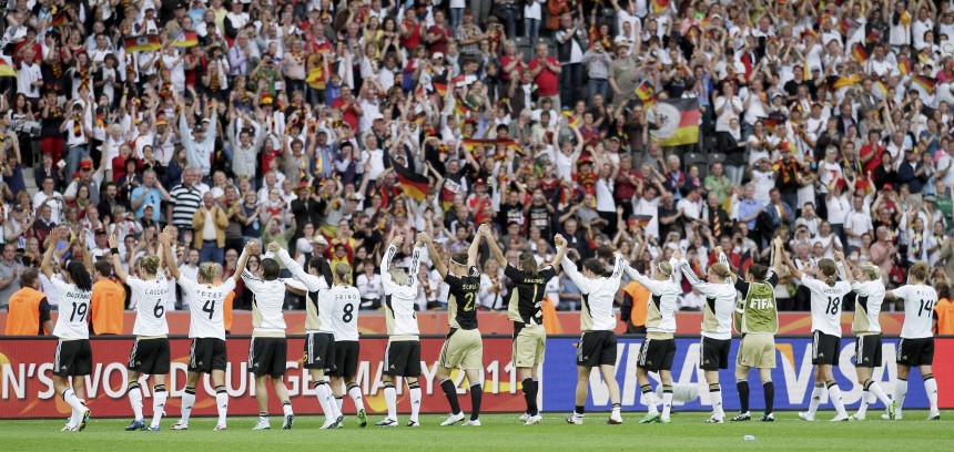 Germany's team celebrate their victory against Canada during their Women's World Cup Group A soccer match in Berlin