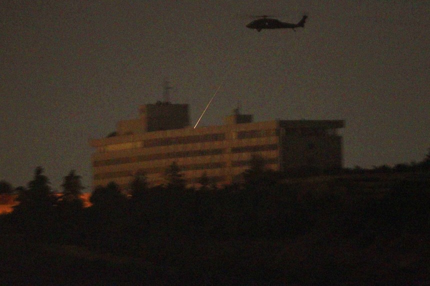A NATO helicopter fires a missile on the roof of the Intercontinental hotel in Kabul
