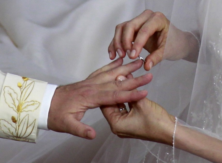 Monaco's Prince Albert II and Princess Charlene exchange rings during their religious wedding ceremony at the Palace in Monaco