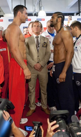 Heavyweight boxers, IBF and WBO titleholder Klitschko of Ukraine and WBA champion Haye of Britain stand face to face after their weigh-in in Hamburg