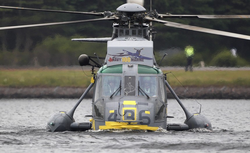 A Canadian forces Sea King helicopter flown by Britain's Prince William lands on Dalvay lake