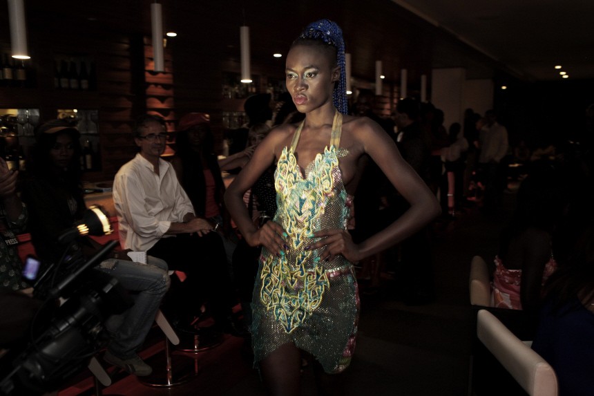Senegalese model Dieng presents a creation by Ghanaian designer Arthur at a show during Dakar Fashion Week in Senegal's capital
