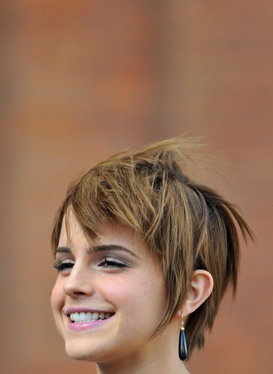 British actress Emma Watson who plays Hermione in the Harry Potter series of films poses for photographers in London