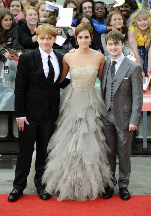 Actress Emma Watson poses with fellow cast members Daniel Radcliffe and Rupert Grint as they arrive for the world premiere of 'Harry Potter and the Deathly Hallows: Part 2' at Trafalgar Square in London