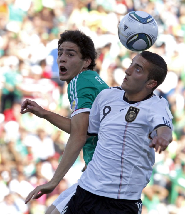 Mexico captain Briseno jumps for the ball with Germany's Yesil during their U-17 World Cup semi-final soccer match in Torreon