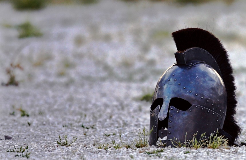 Helmet lies in sand in Roman amphitheatre after performance by Hungarian Collegium Gladiatorium fighting club in Pula