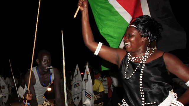 People take part in South Sudan's independence day celebrations along the streets of Juba