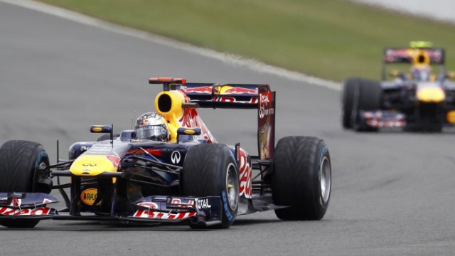 Red Bull Formula One driver Vettel of Germany, drives ahead of team-mate Webber of Australia during the British F1 Grand Prix at Silverstone, central England