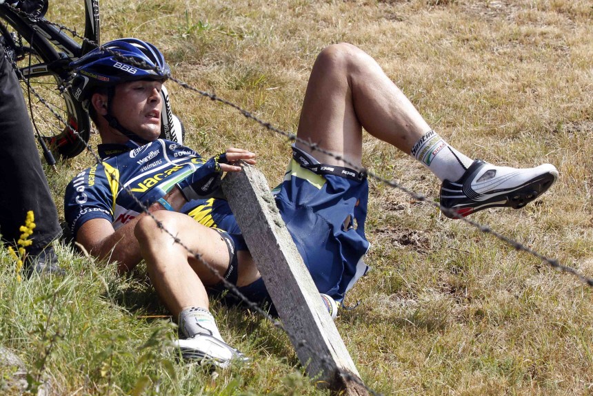 Vacansoleil-DCM rider Hoogerland of Netherlands lies down after crashing during the ninth stage of the Tour de France 2011 cycling race