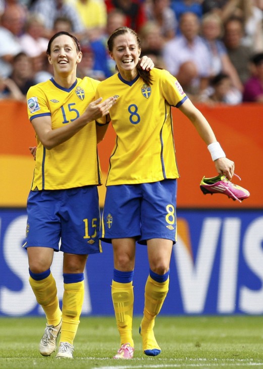Schelin of Sweden celebrates with her teammate Sjorgan after scoring against France during their Women's World Cup third place soccer match in Sinsheim