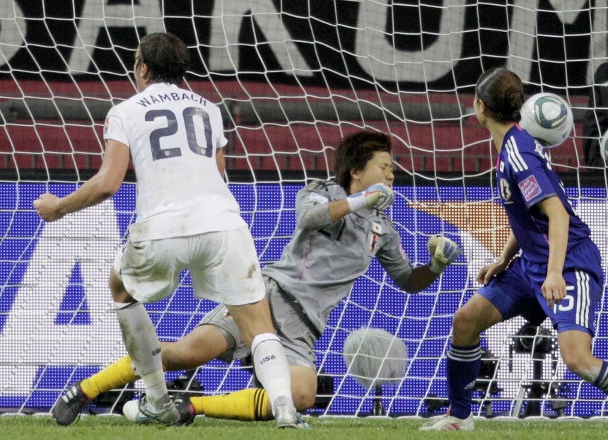 Wambach of the U.S. scores against Japan's goalkeeper Kaihori during their Women's World Cup final soccer match in Frankfurt