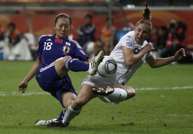 Maruyama of Japan fights for the ball with Buehler of the U.S. during their Women's World Cup final soccer match in Frankfurt