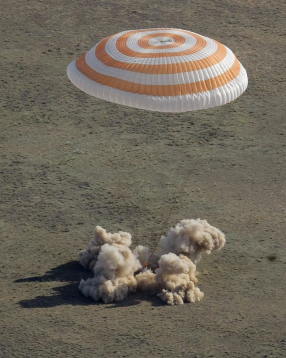 A Russian Soyuz TMA-20 craft lands southeast of the Kazakh town of Zhezkazgan