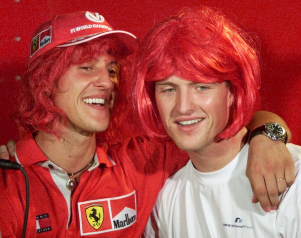 THE SCHUMACHER BROTHERS WEAR SCARLET WIGS IN SEPANG