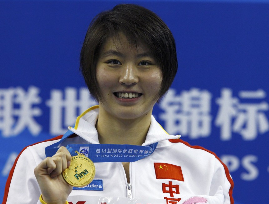 China's Jiao poses with her gold medal for the women's 200m butterfly final at the 14th FINA World Championships in Shanghai