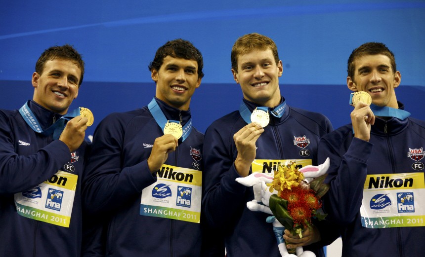 U.S. swimmers pose with their gold medals for the men's 4x200m freestyle relay final at the 14th FINA World Championships in Shanghai