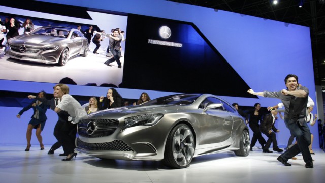 Dancers surround the Mercedes-Benz A Class concept car after it was unveiled at the New York International Auto Show in New York City