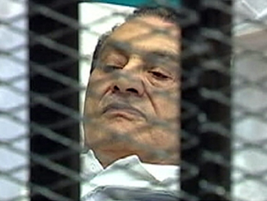 Former Egyptian President Hosni Mubarak is seen in the courtroom for his trial at the Police Academy in Cairo