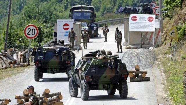France's KFOR soldiers control the road near the Serbia-Kosovo border crossing in Brnjak