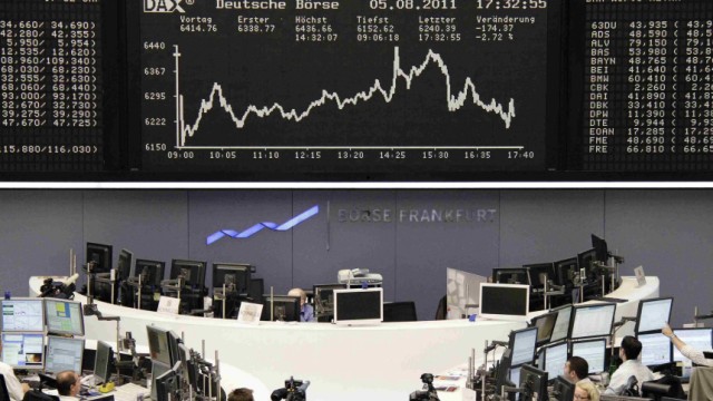 TV crews film the DAX board at the Frankfurt stock exchange
