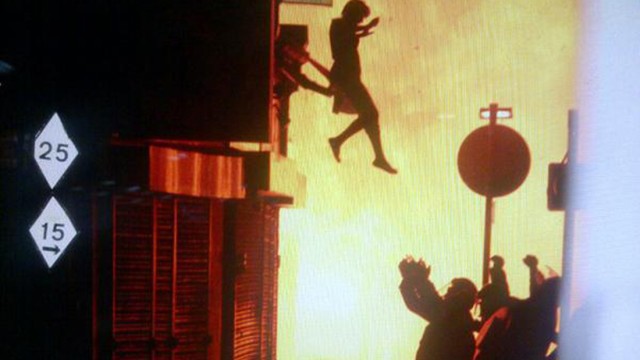 A woman jumps from a burning building in Surrey Street in London