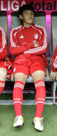 Bayern Munich's Usami sitting at bench before German Bundesliga soccer match against Borussia Moenchengladbach in Munich