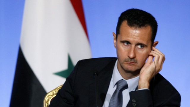 Syria's President Bashar al-Assad attends a news conference at the Elysee Palace in Paris