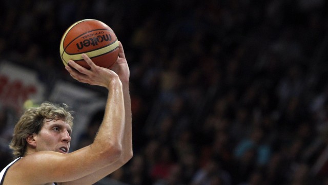 Dirk Nowitzki of Germany tries to score during their men's basketball BEKO Supercup game against Belgium in Bamberg