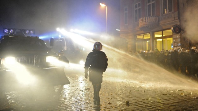 Police use water cannons during clashes at the so- called street party 'Schanzenfest' in the Schanze district in Hamburg