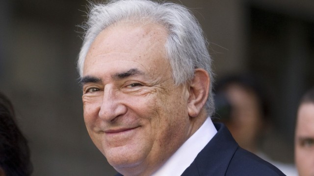 File photo of Dominique Strauss-Kahn smiling as he departs a hearing at the New York State Supreme Courthouse in New York