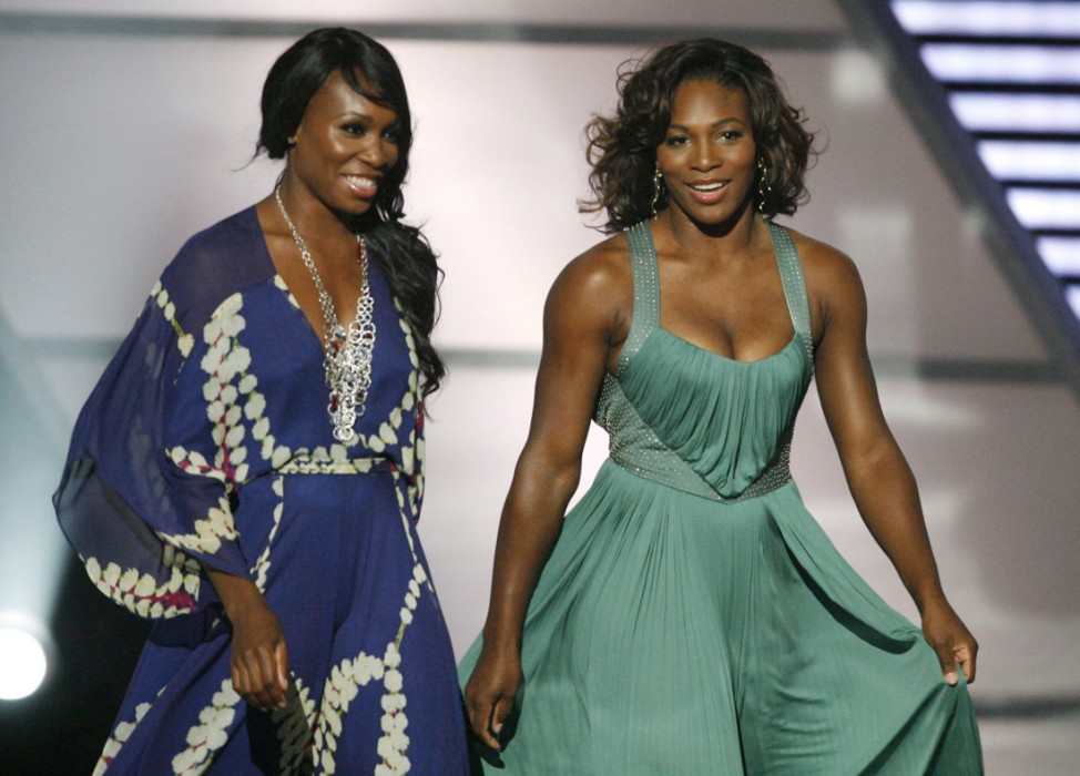 Venus (L) and Serena Williams walk on stage during the taping of the 2009 ESPY Awards  in Los Angeles
