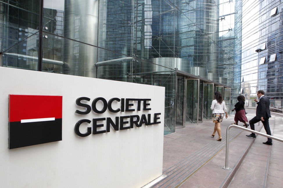 People enter the headquarters of French bank Societe Generale at La Defense, west of Paris