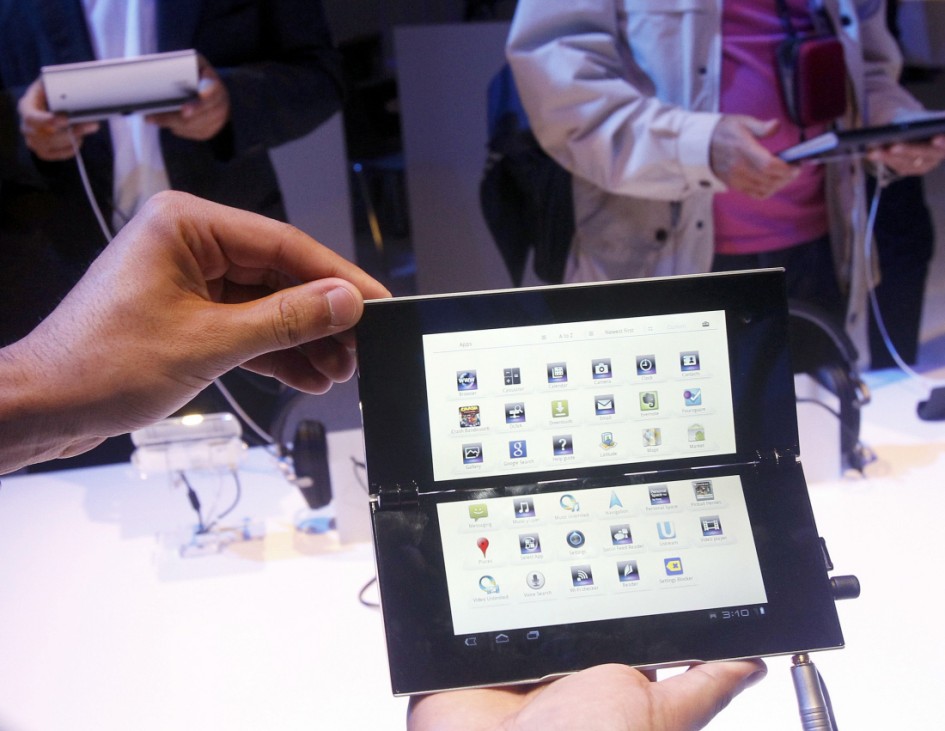Media scrutinize new Sony P tablet at the IFA consumer electronics fair in Berlin