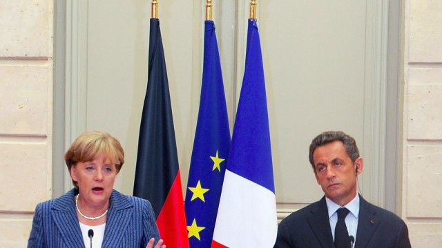 President Nicolas Sarkozy and German Chancellor Angela Merkel Meeting At Elysee Palace