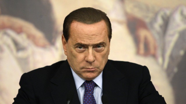 Italian Prime Minister Silvio Berlusconi attends a news conference at Chigi palace in Rome