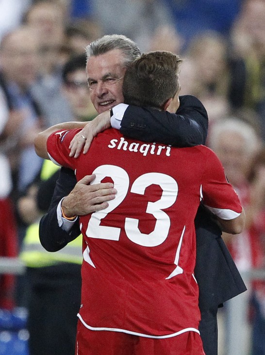 Switzerland's headcoach Hitzfeld comforts Shaqiri reacts after scoring his third goal against Bulgaria during their Euro 2012 Group G qualifying soccer match in Basel