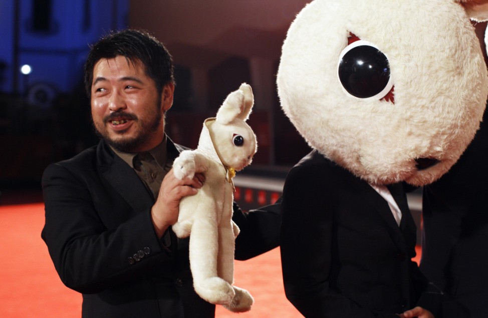 Japanese director Shimizu arrives at a red carpet for his 3D movie 'The Rabbit Horror 3D' at the 68th Venice Film Festival