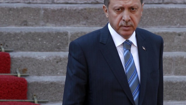 Turkey's Prime Minister Tayyip Erdogan attends a welcoming ceremony in Ankara
