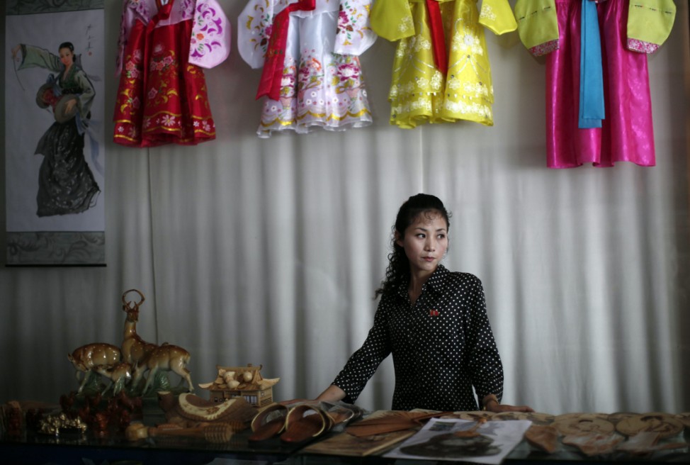 A woman stands in a gift shop in central Rason city, part of the especial economic zone northeast of Pyongyang