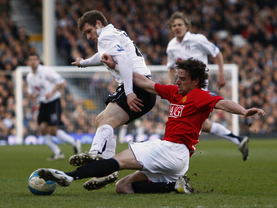 Manchester United's Hargreaves and Fulham's Volz fight for the ball during their soccer match in London