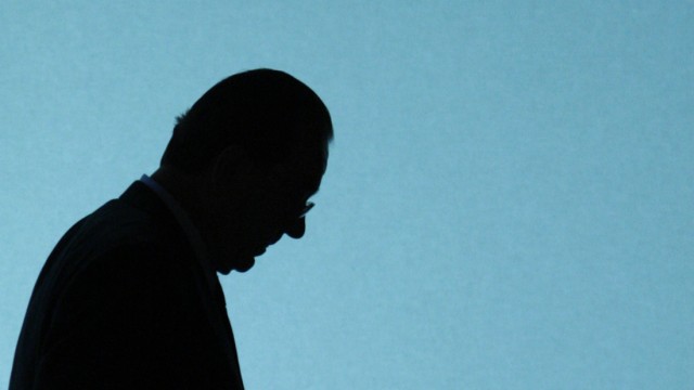 File picture of Swiss bank UBS CEO Gruebel as he is silhouetted walking on stage prior the start of the general shareholders meeting in Zurich