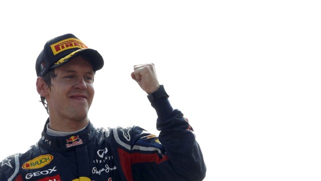 Red Bull Formula One driver Sebastian Vettel of Germany celebrates on podium after winning the Italian F1 Grand Prix at the Monza circuit