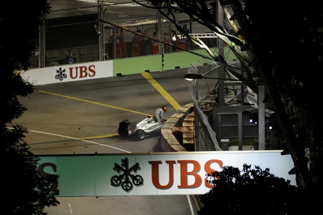 Mercedes Formula One driver Schumacher gets out of his car after he crashed during the Singapore F1 Grand Prix at the Marina Bay street circuit in Singapore