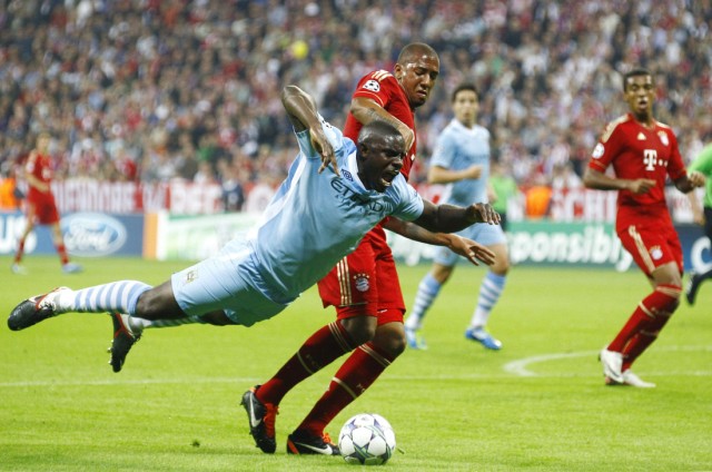 Richard of Manchester City falls after challenge by Boateng of Bayern Munich during their Champions League Group A soccer match in Munich