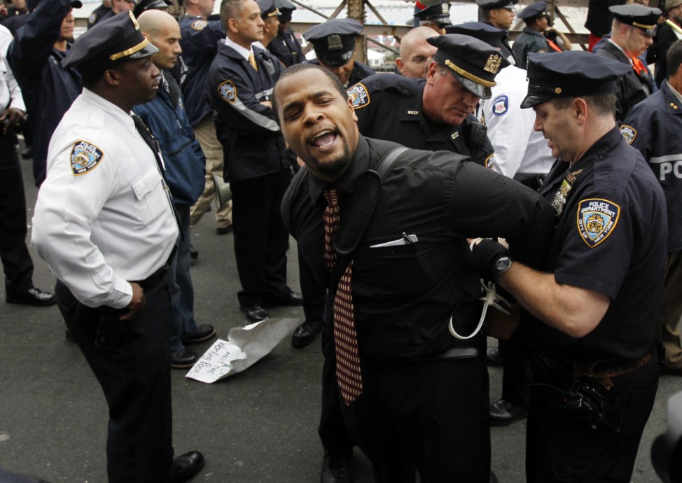 A protester reacts as he is arrested on the Brooklyn Bridge during an Occupy Wall Street protest in New York