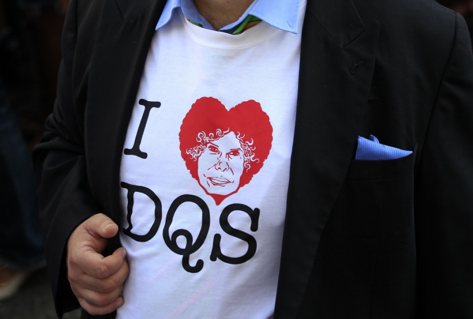 A man wears a souvenir t-shirt reading 'I love DuQueSa (Duchess)' outside Las Duenas Palace as he waits for guests to arrive before the wedding of Spain's Duchess of Alba with Alfonso Diez in Seville