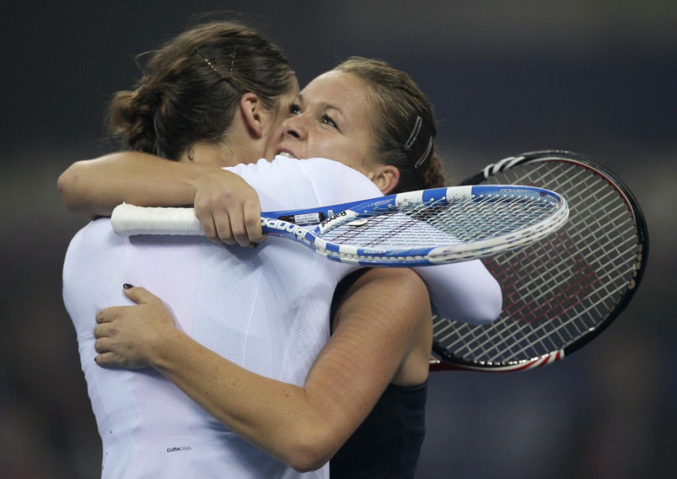 Radwanska of Poland hugs Petkovic of Germany after she won the women's final match at the China Open tennis tournament in Beijing