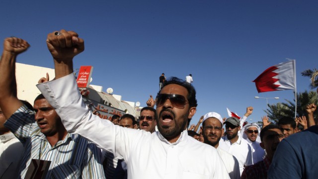 Family members and supporters shout anti-government slogans during a funeral procession held in Budaiya, west of Manama